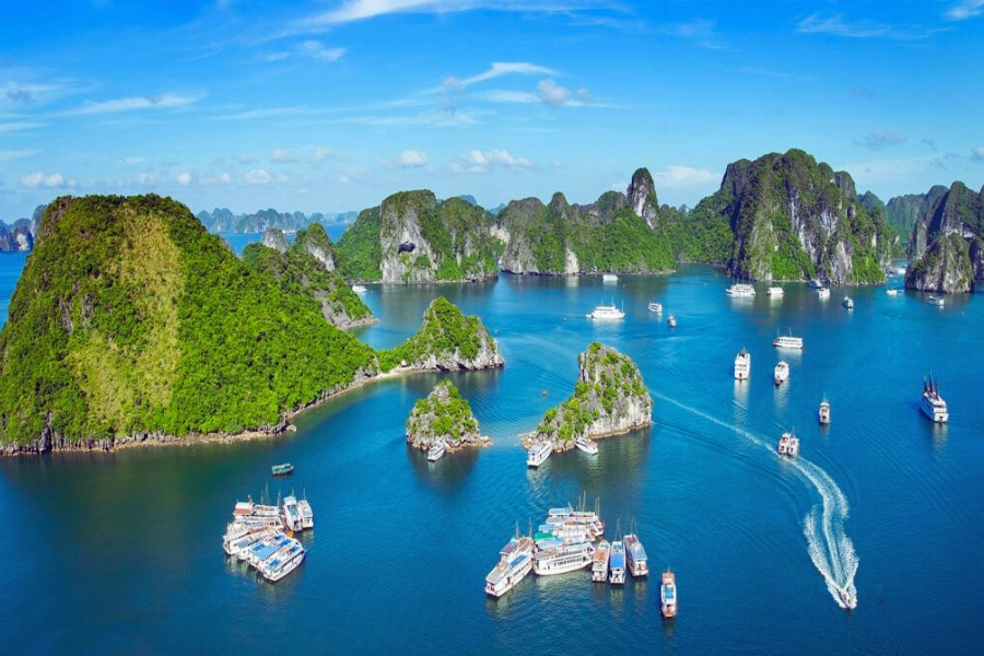 Scenic Halong Bay with limestone islands and cruise boats in Vietnam – Auasia Travel